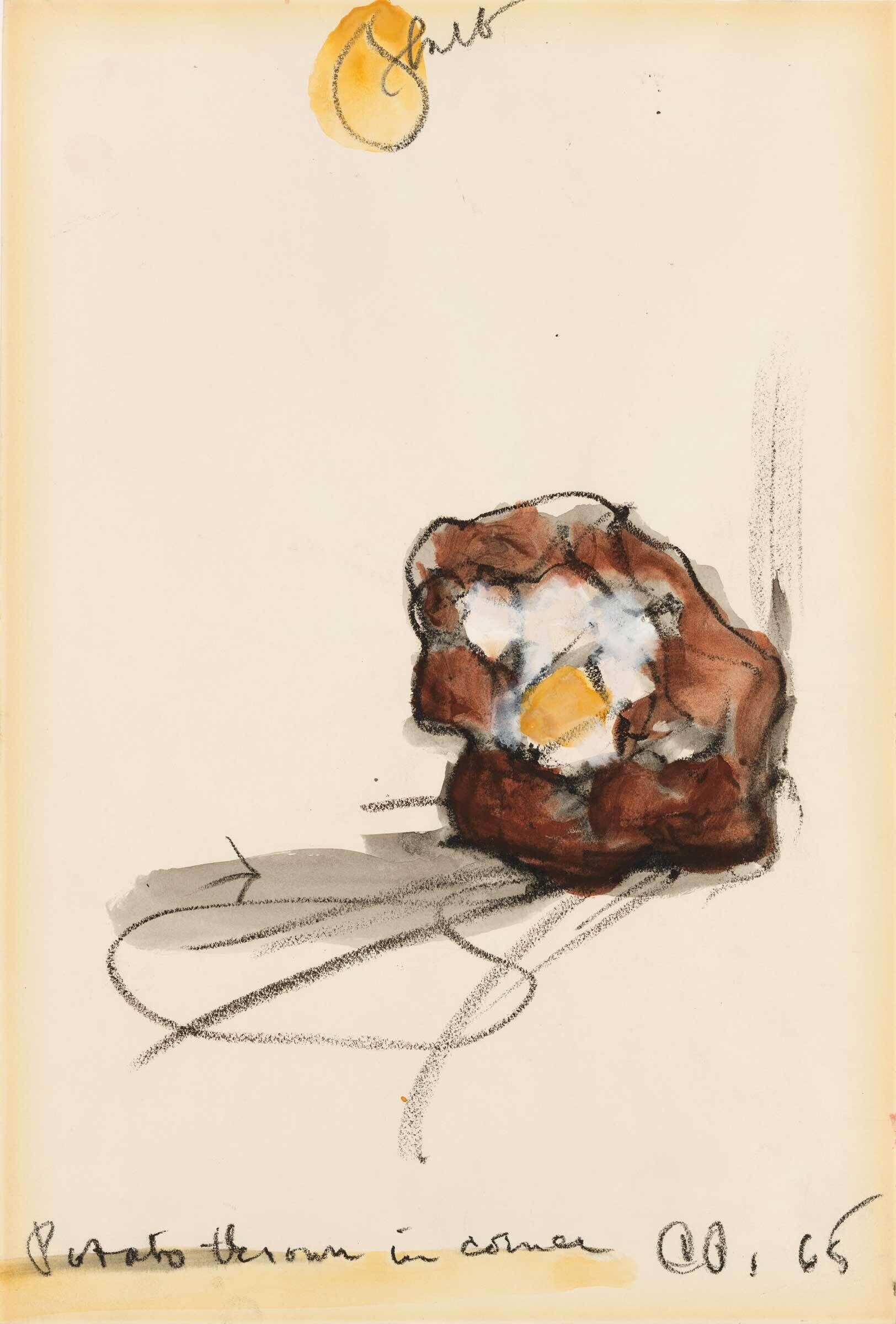 A brown potato with a yellow and white center sits on a surface, with handwritten text below and above.
