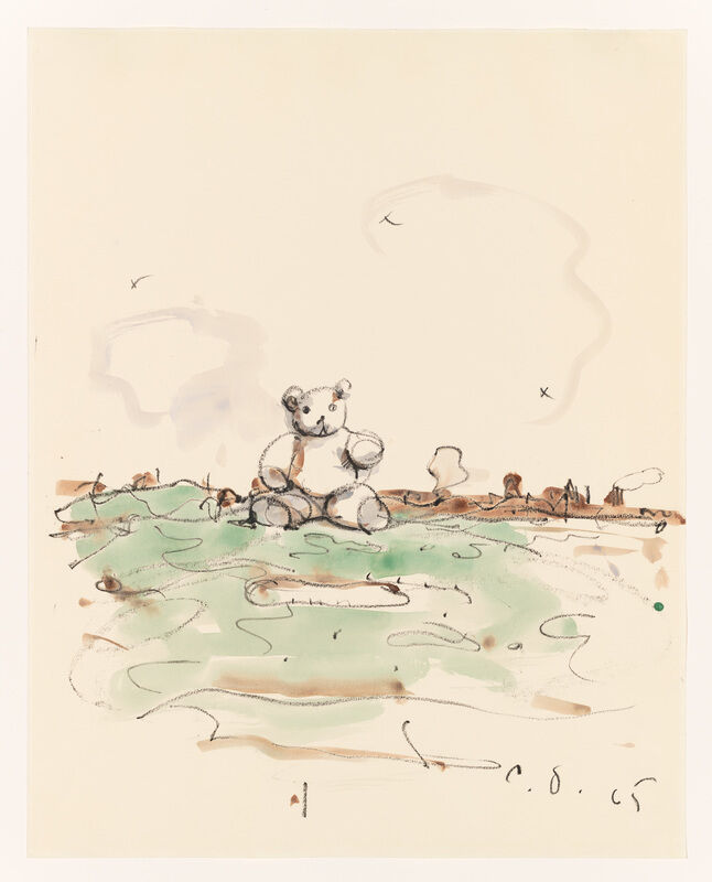 A teddy bear sits alone on a grassy field with a few birds flying in the sky.