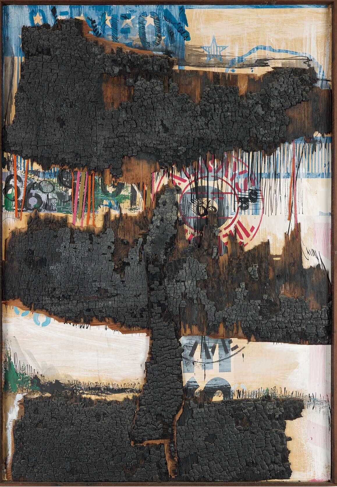 A large, charred, burnt wooden surface with layers of paint, numbers, stars, and abstract shapes partially visible underneath.