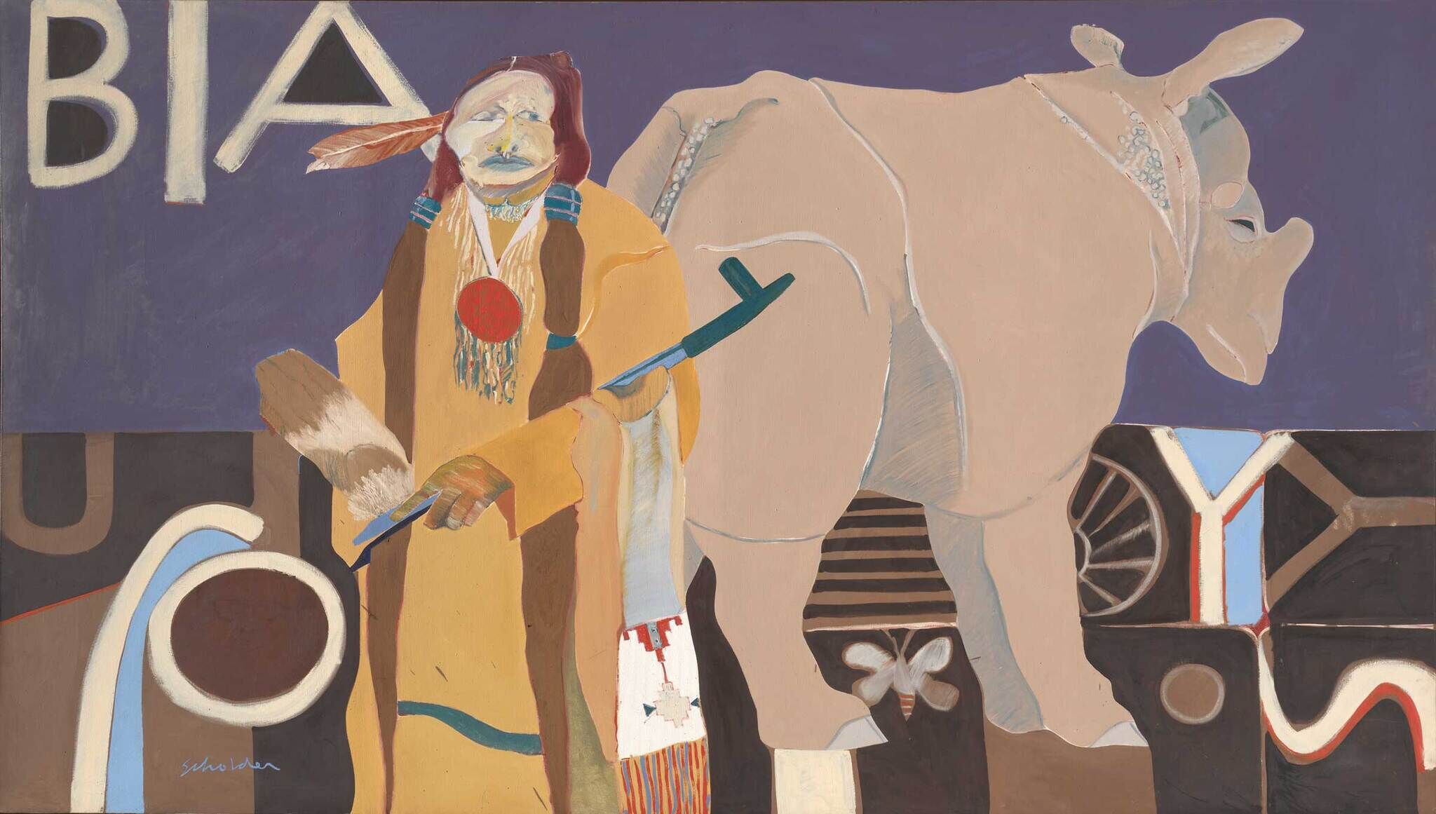 A person in traditional clothing stands beside a large rhinoceros, with the letters "BIA" in the background.