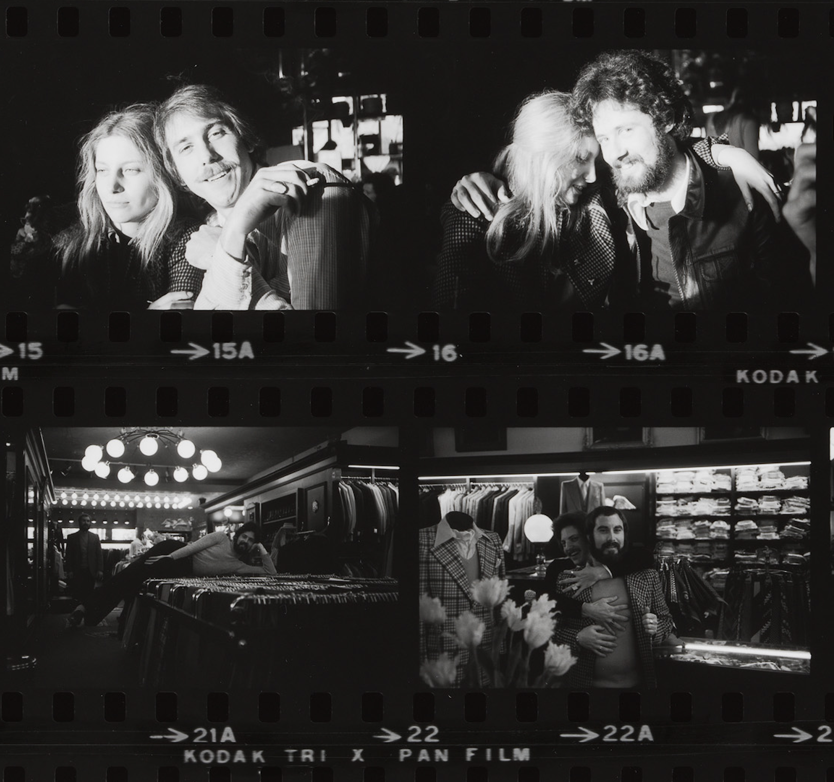 Four black-and-white film photos show two people together in a clothing store, hugging, laughing, and posing playfully.