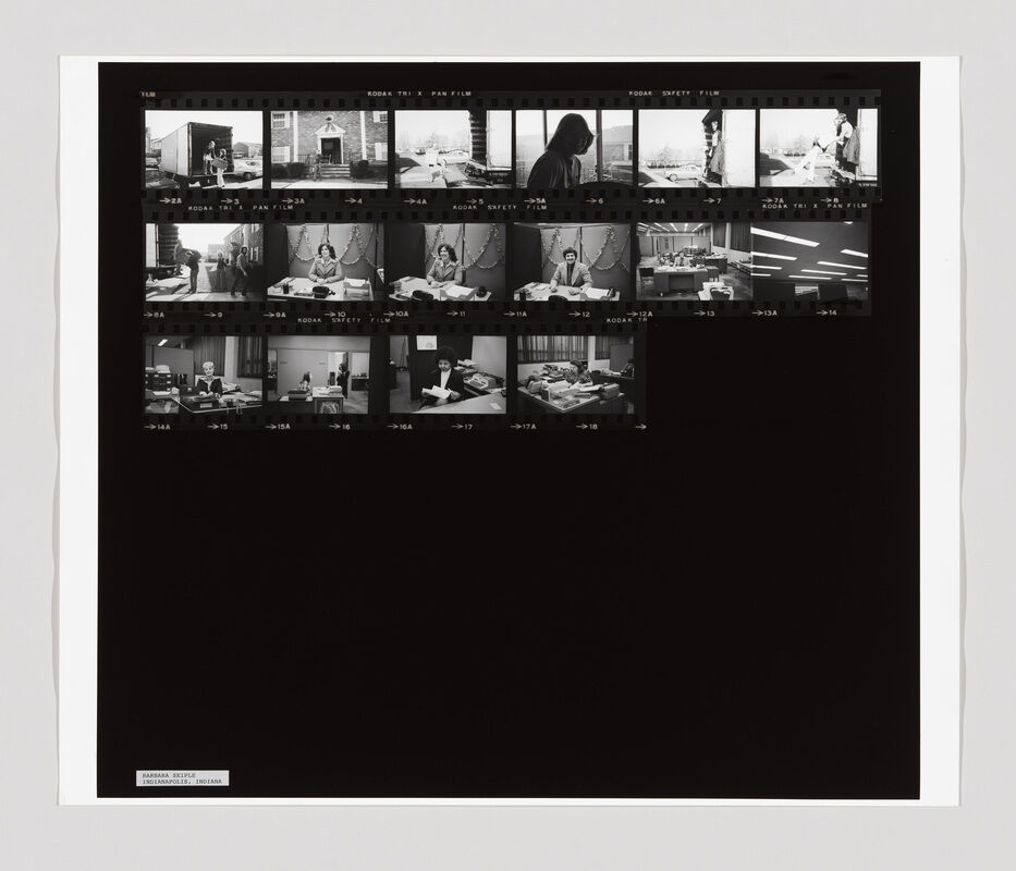 A contact sheet with black-and-white photos showing people working at desks and interacting in an office setting.