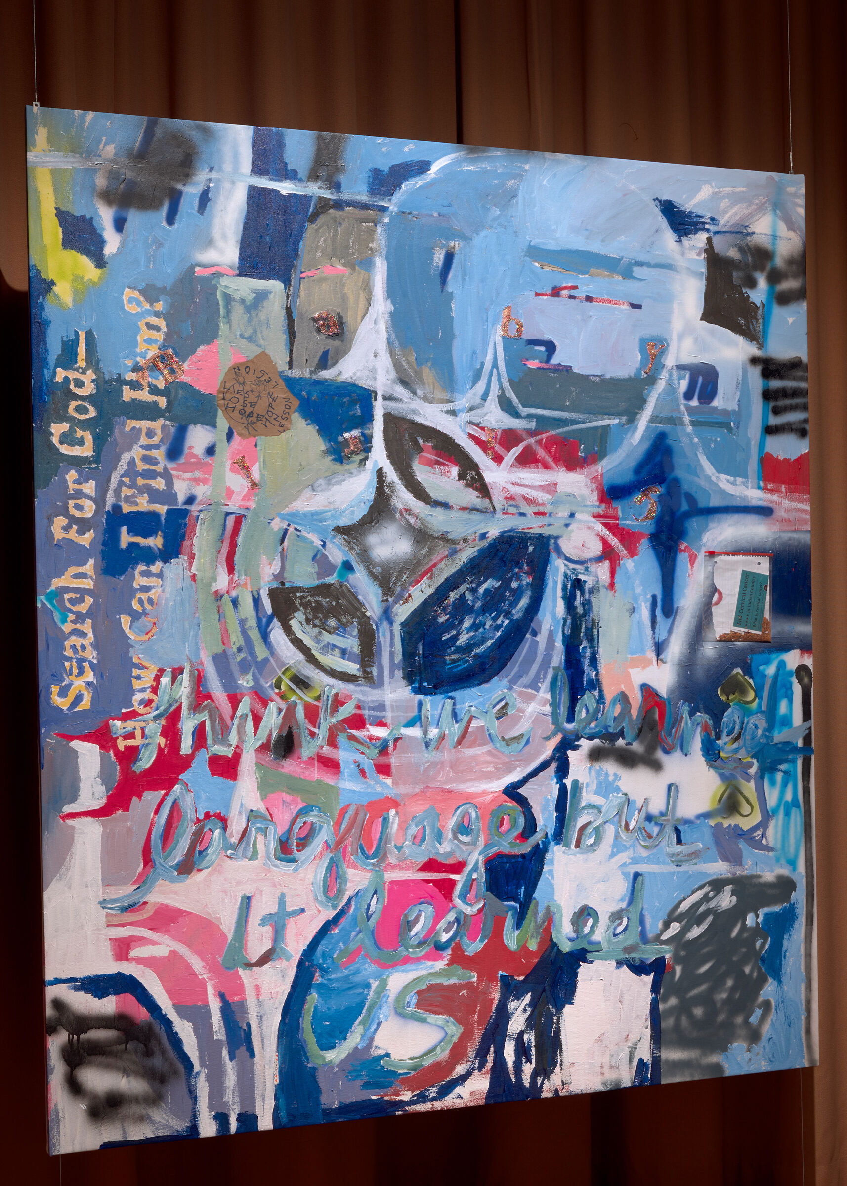 Large colorful abstract painting with layered shapes, text scrawls, and bold blue and pink brushstrokes.