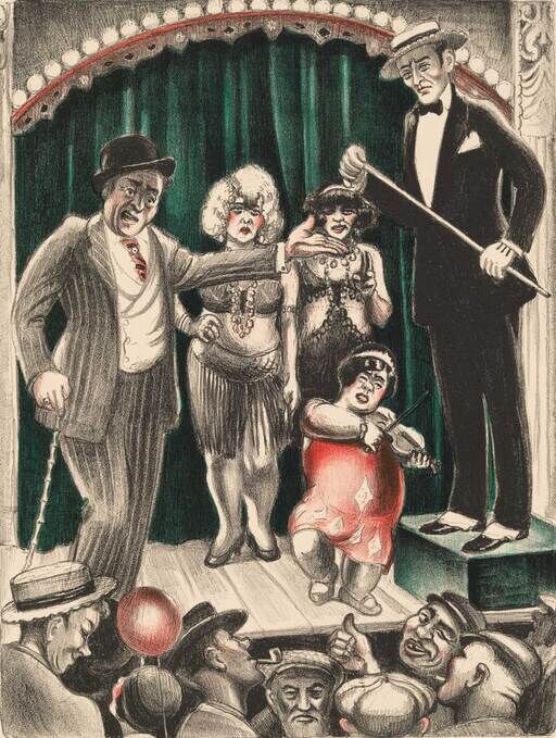 A group of vaudeville performers on stage entertain a crowded audience while a man conducts.