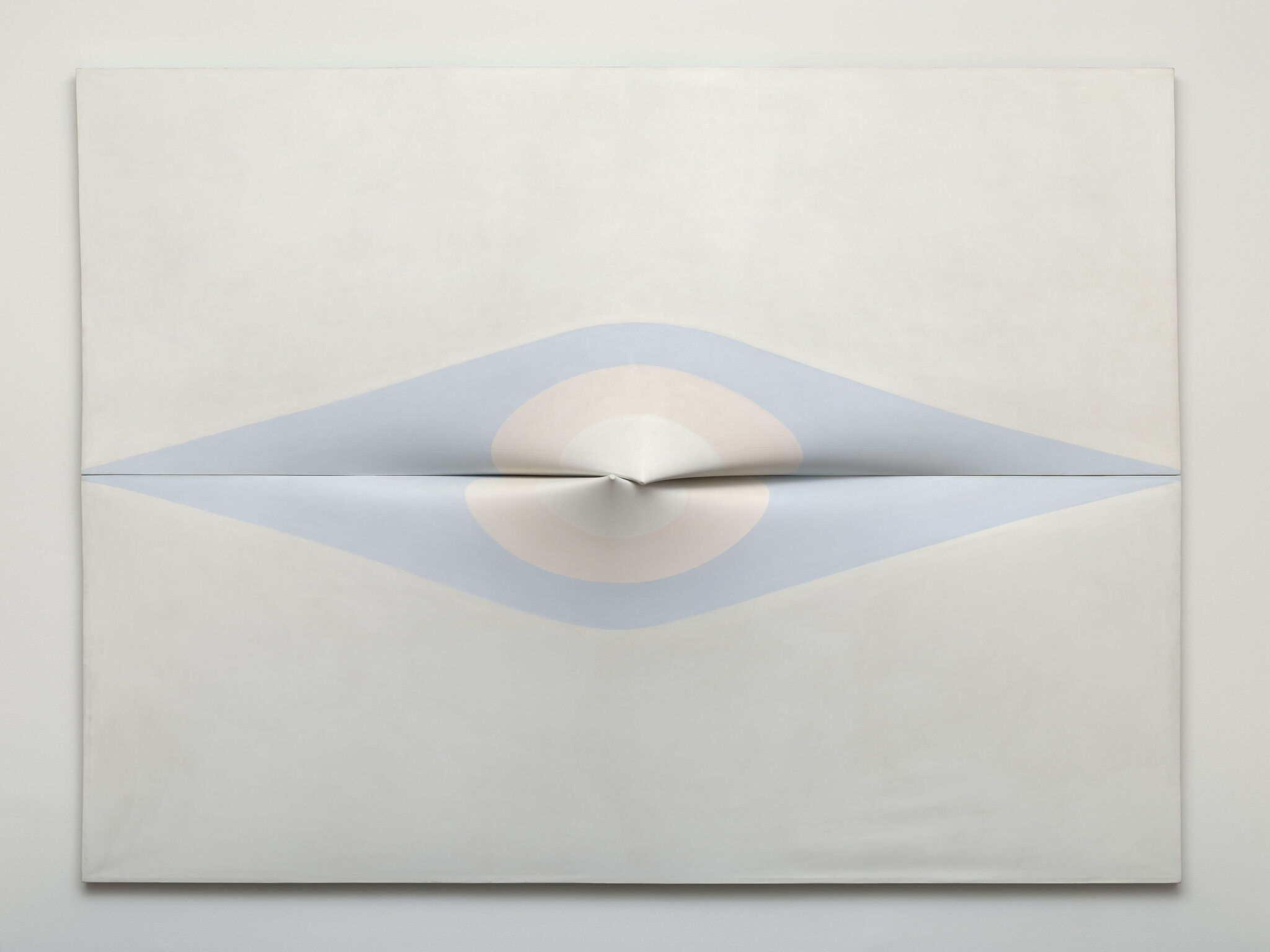 A pale blue elongated diamond shape frames a horizontal centerline that pierces a large white painting. Inside it, concentric circles of pale pink and white frame two protruding shapes that emerge physically from the center of the canvas, one from just above the horizontal centerline and another from below, that meet with a subtle embrace. 
