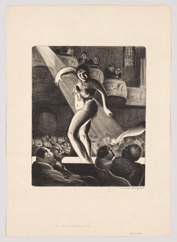 A female stage performer dances under a spotlight while an audience watches from seats.