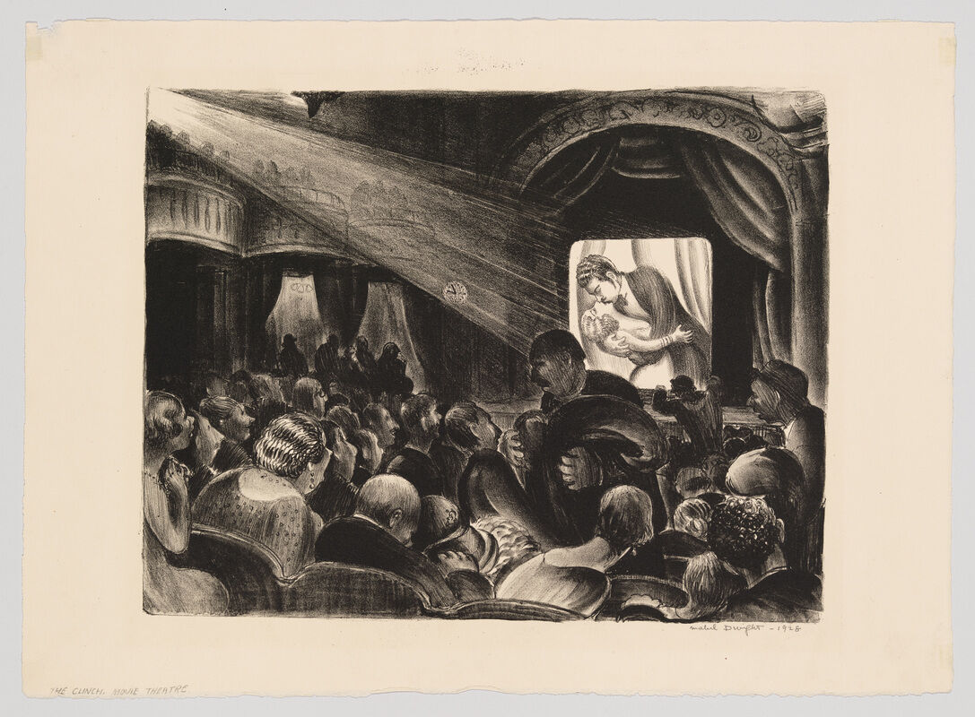 Audience crowded in an old theater watching a romantic couple embrace on the screen.