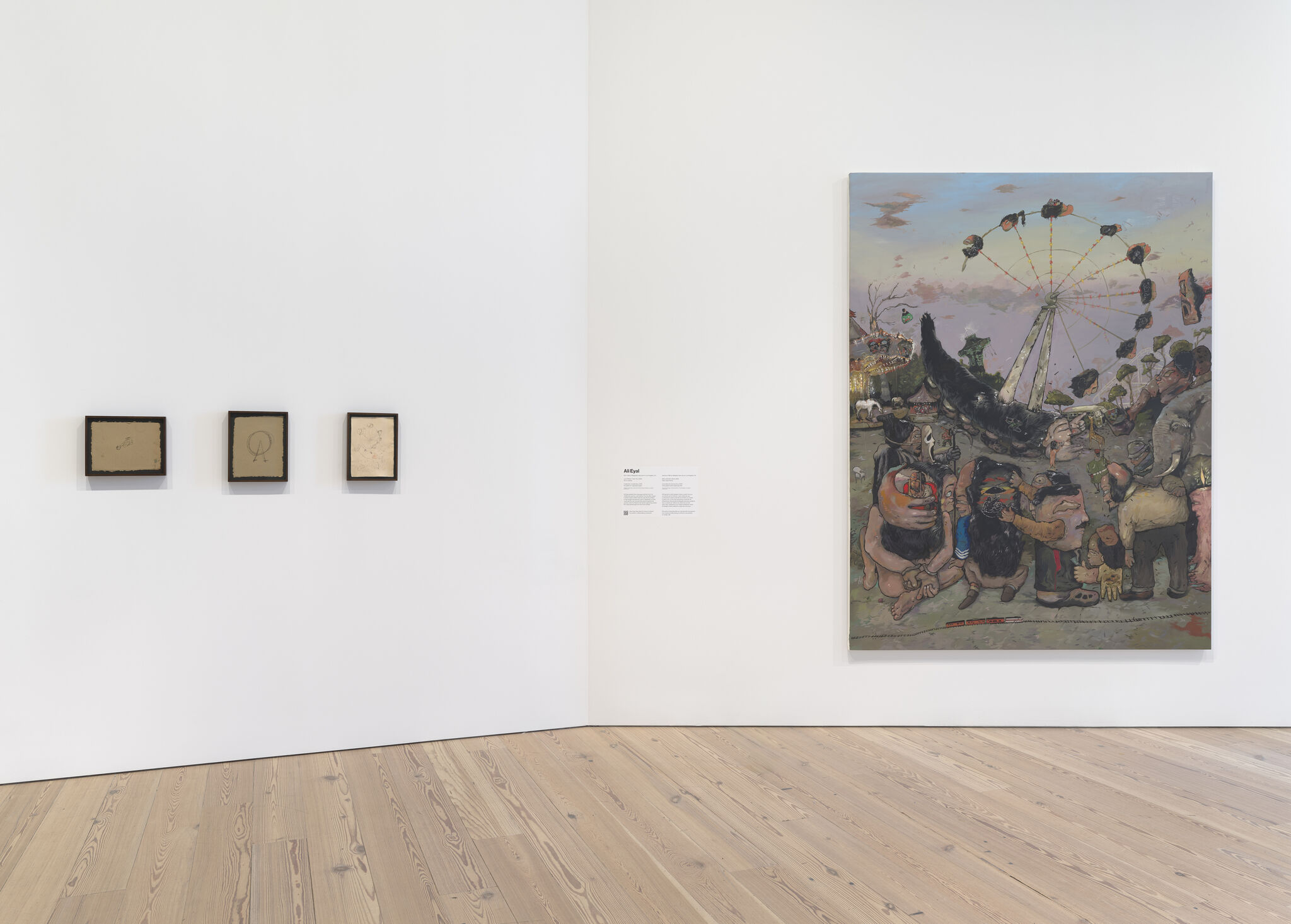 A gallery wall displaying three small framed sketches and one large chaotic carnival painting with people.