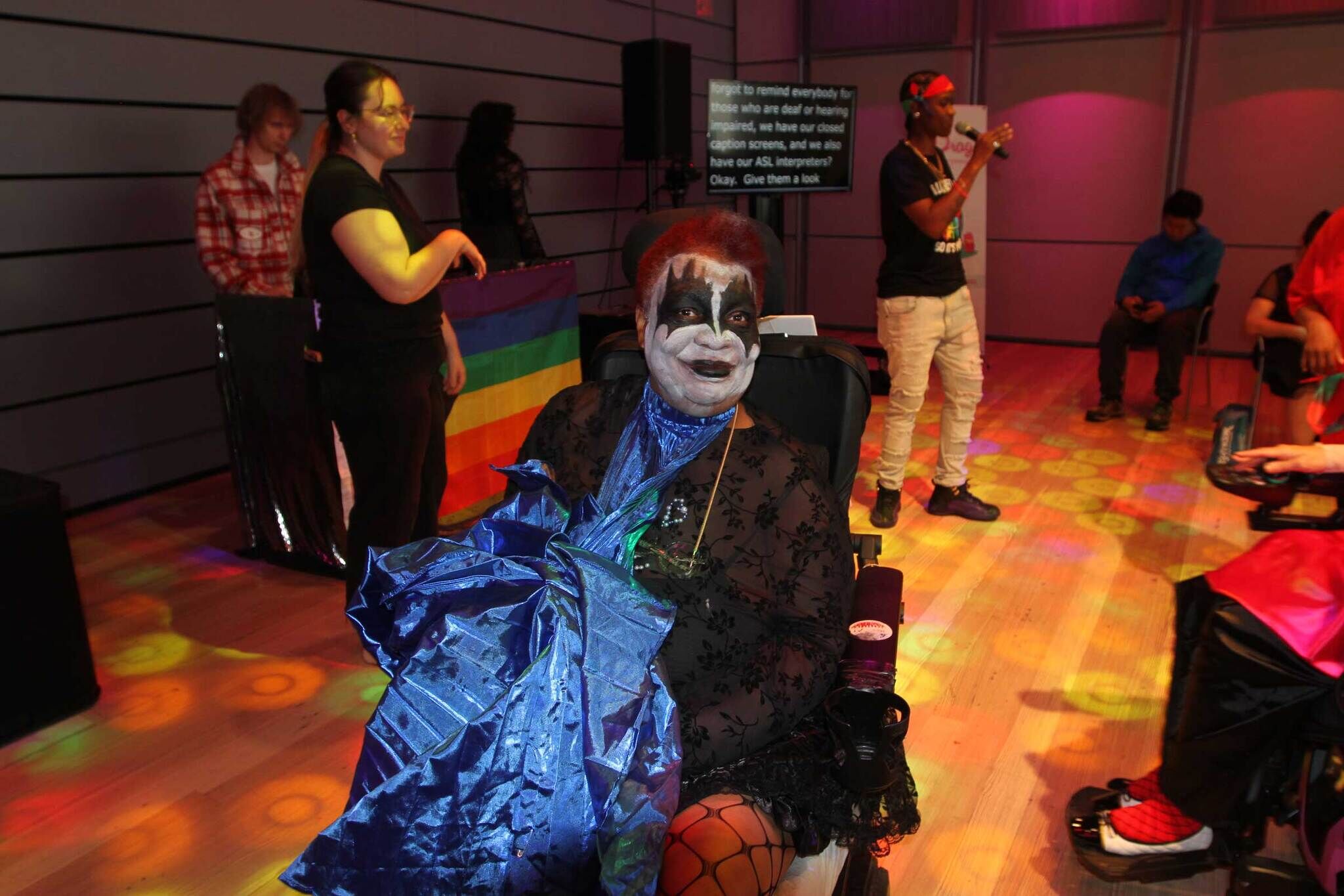 ADAPT participant smiles while wearing their Radical Joy Ball costume.