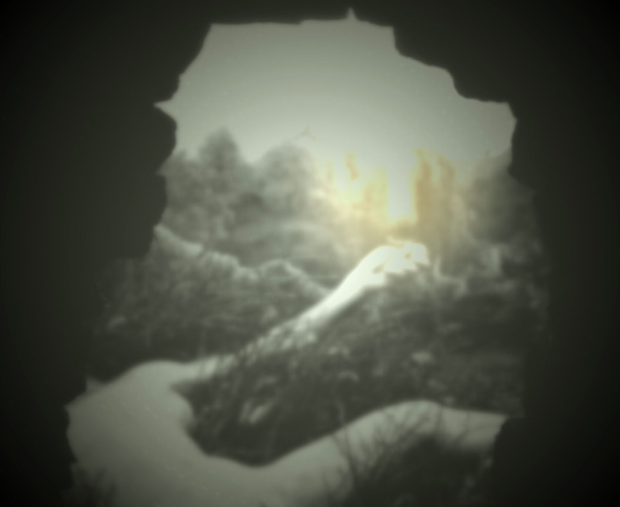 View through what appears to be a cave of a blurred person lying and reaching out a hand holding a lantern.