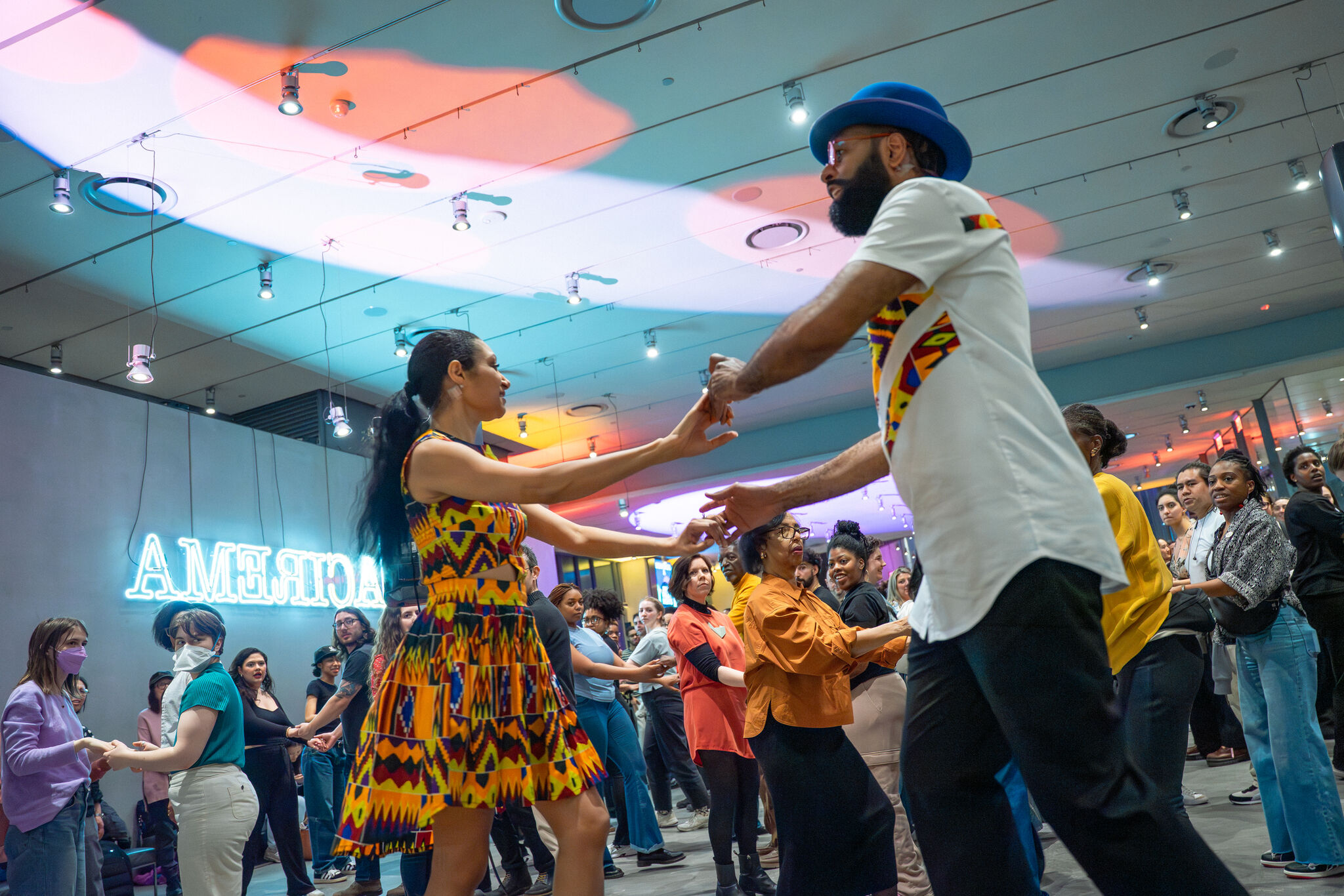 Line dancing class in Museum lobby