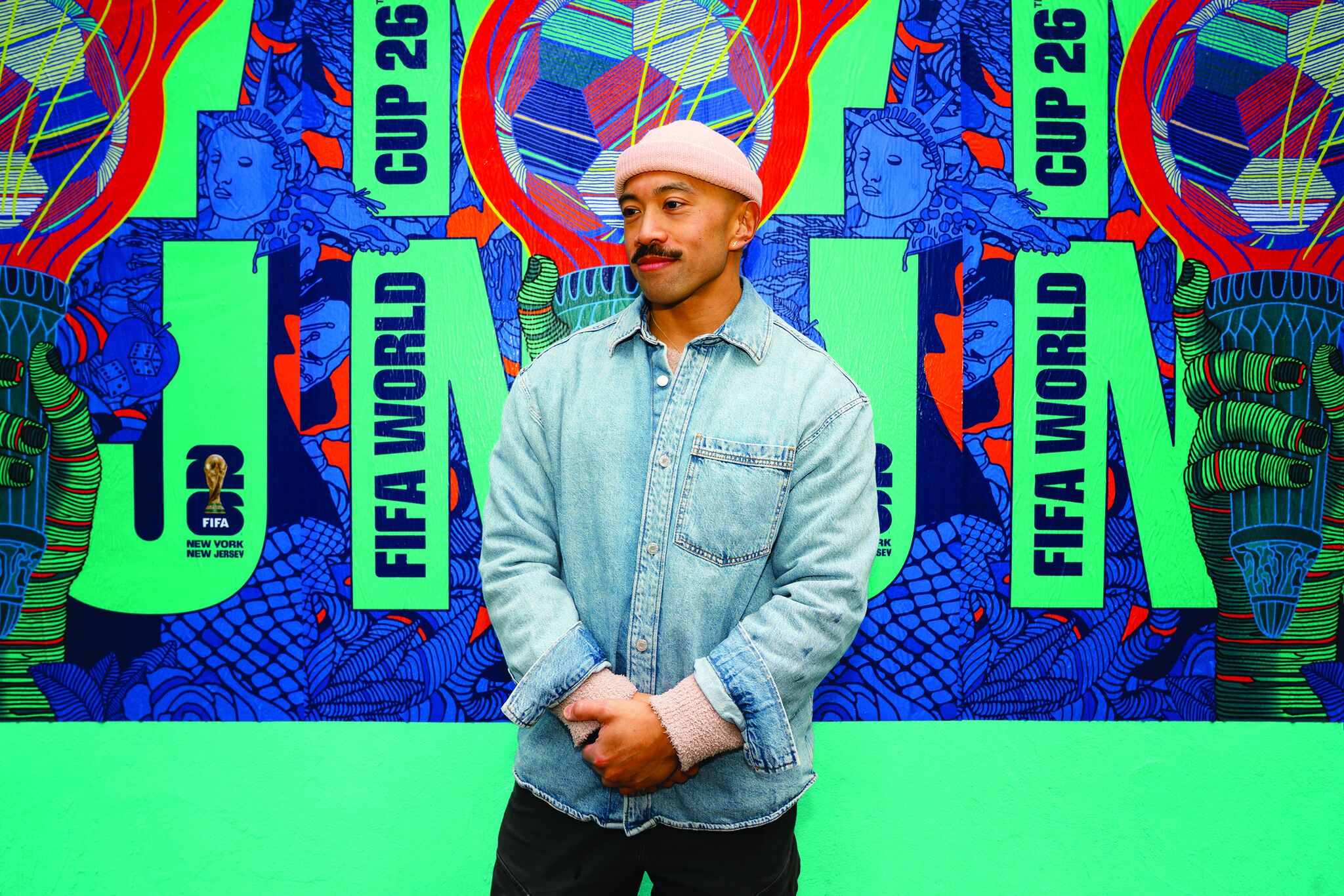 Rich Tu headshot in front of a FIFA World Cup 2026 poster.