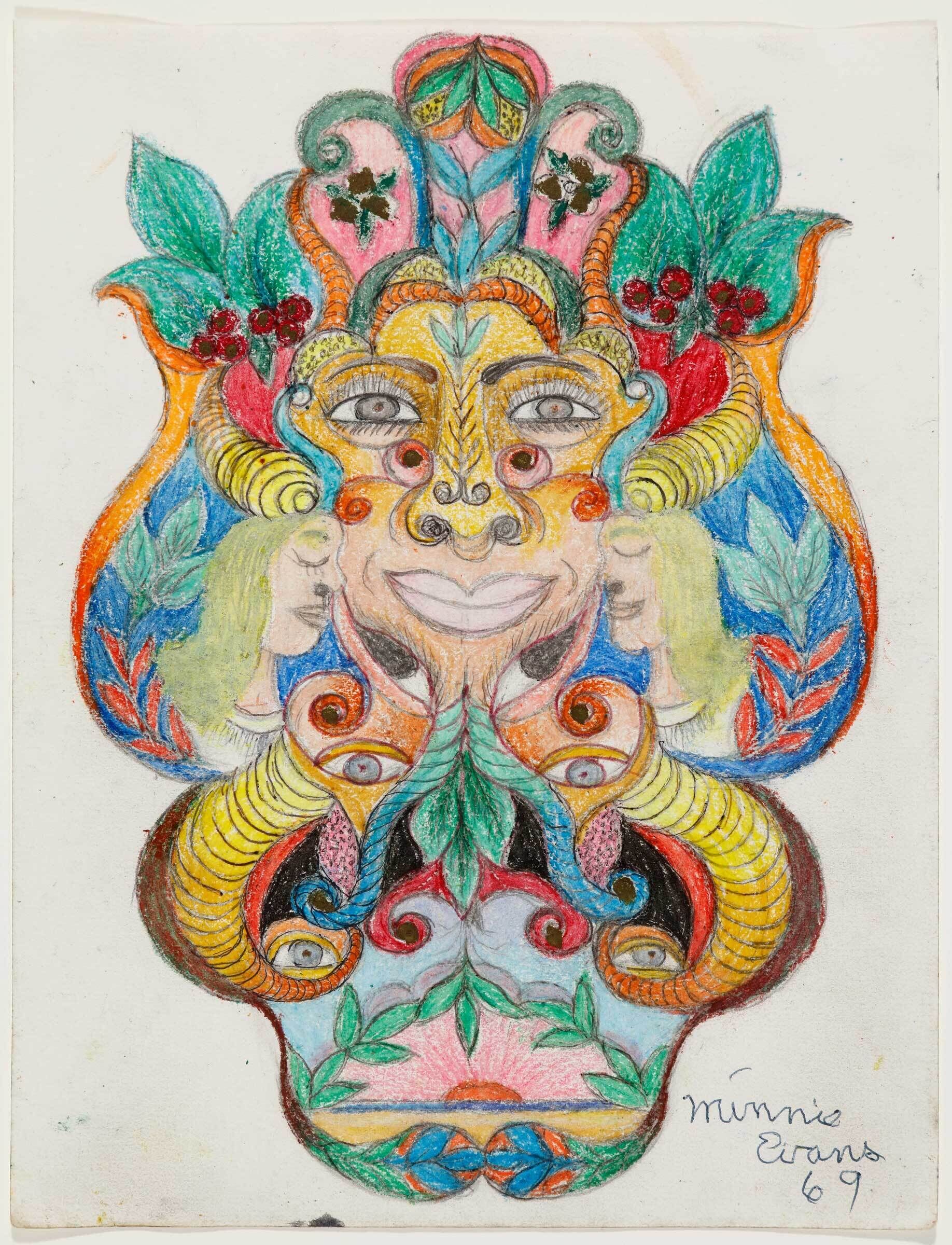 A colorful symmetrical mask-like face made of leaves, horns, eyes, and swirling decorative patterns.
