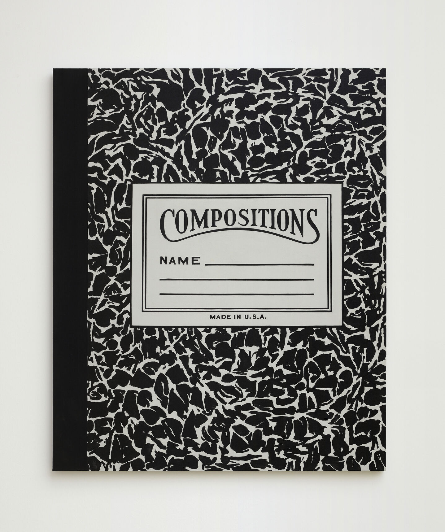 Black-and-white marbled composition notebook with a front label reading "Compositions" and lines for a name.
