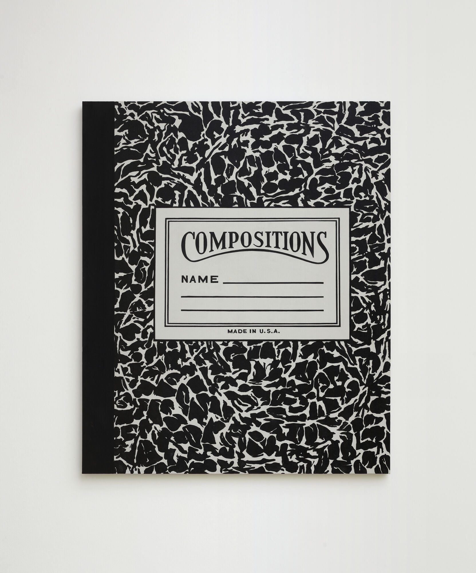 Black-and-white marbled composition notebook with a front label reading "Compositions" and lines for a name.